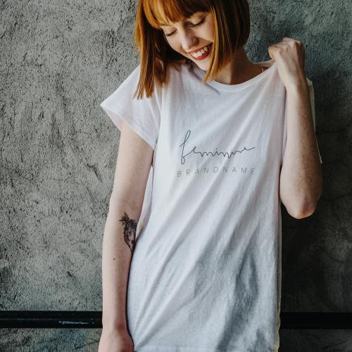 Smiling woman wearing a silk screenwhite t-shirt mockup - 1198620