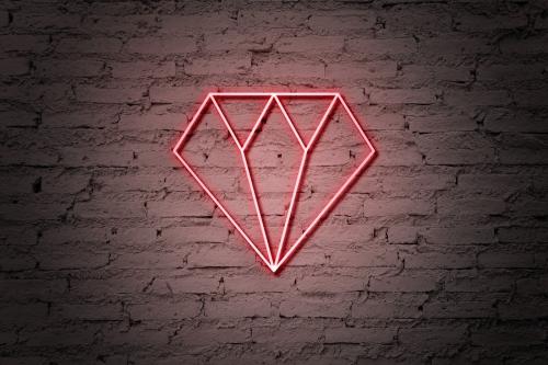 Neon red diamond on brick wall - 894308