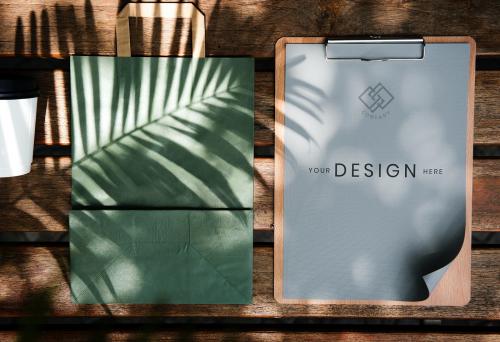 Paper on a clipping board and paper bag mockup - 894811