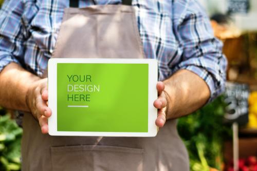 Greengrocer selling fresh organic produce on a tablet screen mockup - 894878