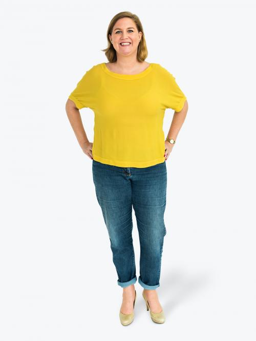 Cheerful woman in a yellow tee character isolated on a white background - 591468
