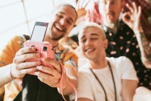 Diverse group of friends taking a selfie at a party - 2097456