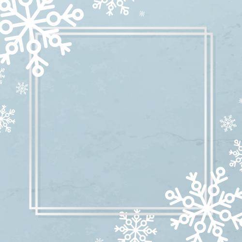 White frame with snowflake patterned on blue background vector - 1227526