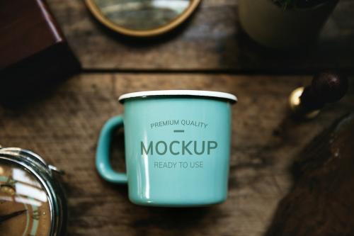 Aerial view of a teal blue cup mockup - 580862