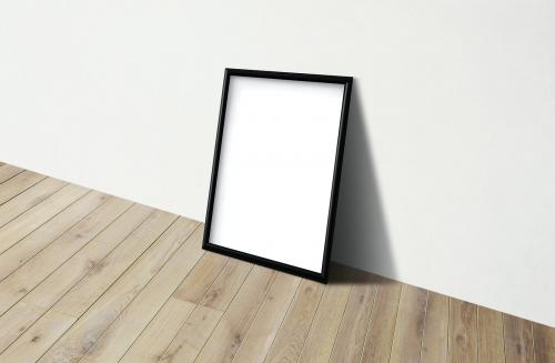 Black frame mockup against a white wall - 586078