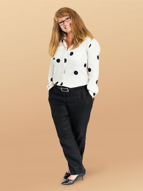 Cheerful woman in a polka dots shirt character isolated on beige background - 591339