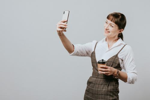 Happy woman taking a picture of herself - 2020104