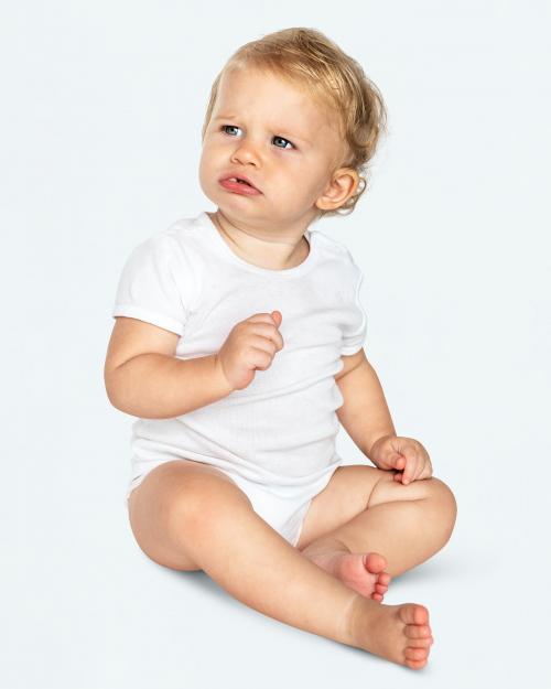 Baby sitting on the floor in a studio - 546197