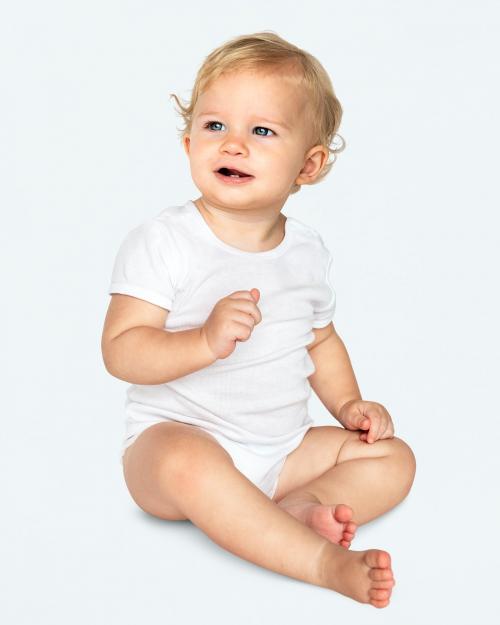 Baby sitting on the floor in a studio - 546207