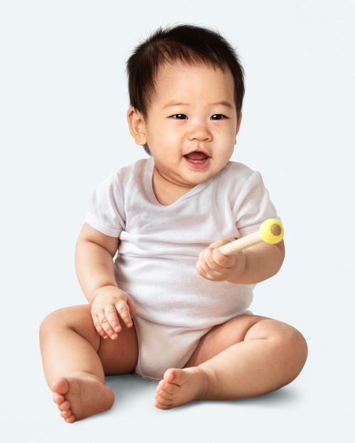 Baby sitting on the floor in a studio - 546247