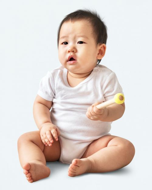 Confused Asian baby girl in a studio - 546256