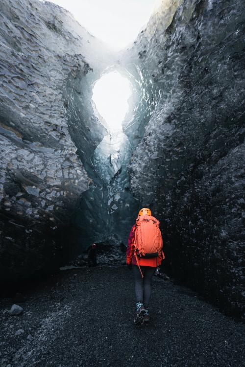 Female explorer walking to the ice cave, Iceland - 2042861