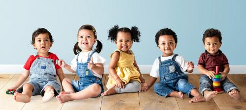 Cute diverse toddlers sitting together on the floor - 536078