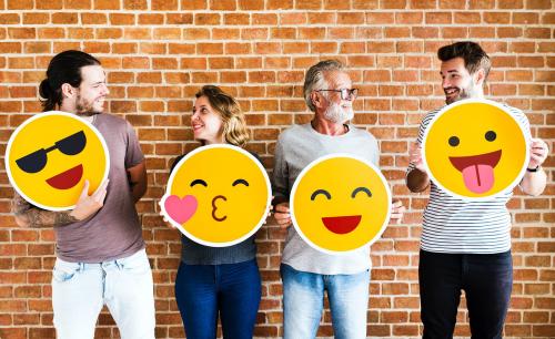 Happy people holding positive emoticons - 537786