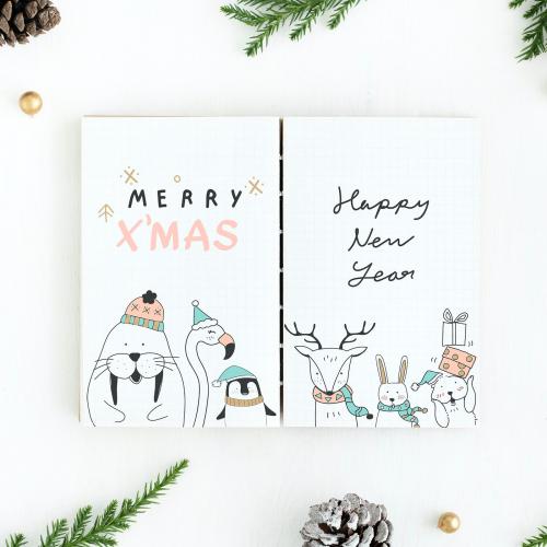 Christmas illustrations in a notebook mockup - 520027