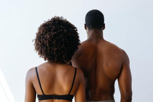 Rear view of seminude black couple - 2025160