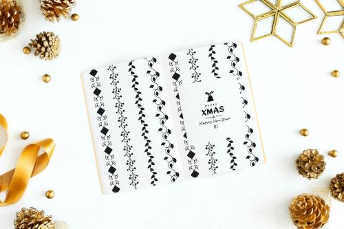 Merry X'Mas and Happy New Year in a notebook mockup - 520143