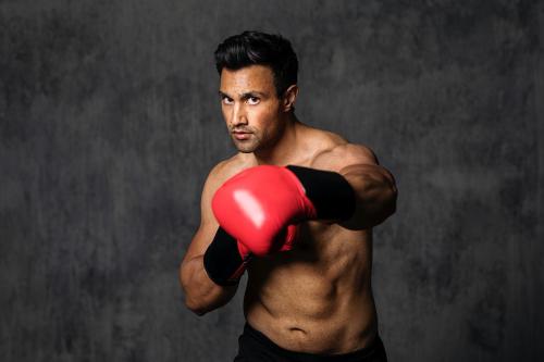 Muscular male boxer with the red boxing gloves - 2107308
