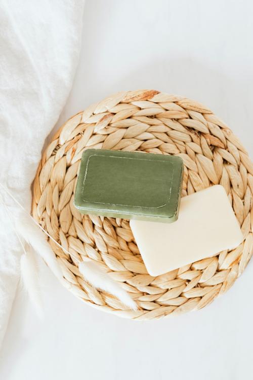 Flat lay organic soap bars with grass flowers in spa setting - 2281926