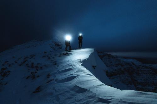 Mountaineers trekking in the cold night at Liathach Ridge, Scotland - 2221523