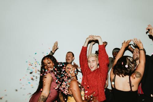 Hands in the air while dancing on the dance floor at a party - 2092559