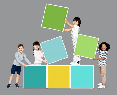 Diverse happy kids stacking empty square boards - 503989