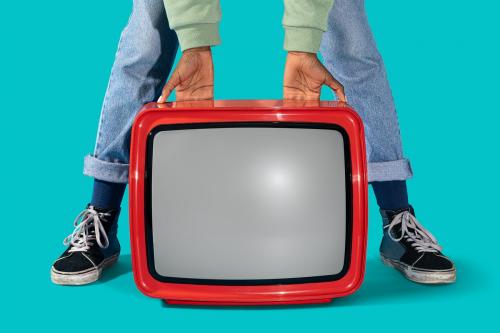 Woman holding an old red television - 2052788