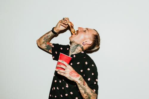 A man eating a pepperoni pizza - 2097354