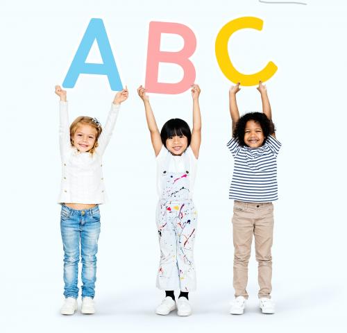 Diverse happy kids learning the ABC - 504162