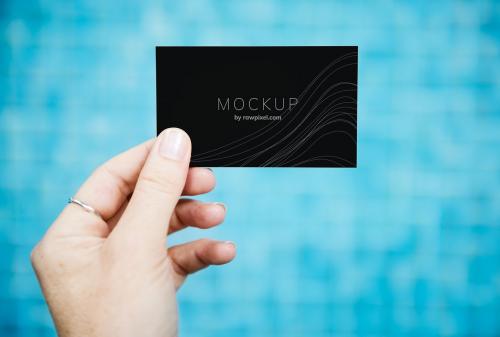 Female hand holding a business card mockup - 502905