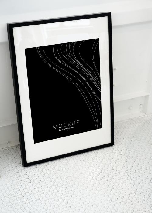 Black picture frame mockup on the floor - 502924