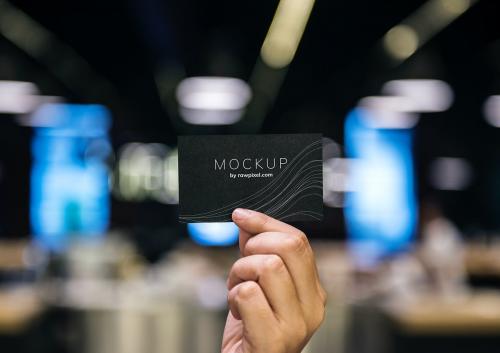 Hand holding a black business card mockup - 502956