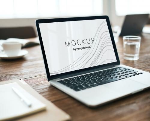 Laptop in a conference room with a screen mockup - 503023