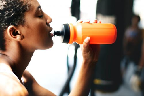 Woman drinking water after workout - 2114604