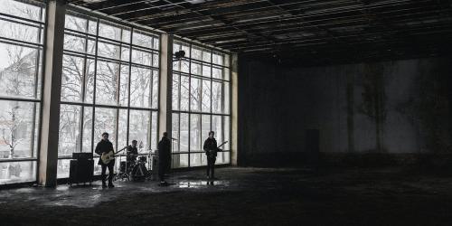 Rock band rehearsing in an abandoned building social banner - 2025078