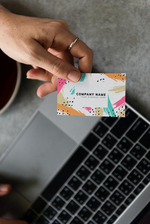 Handing out a business card mockup - 502654