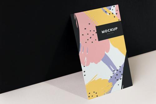 Colorful paperboard mockup against the black wall - 502680