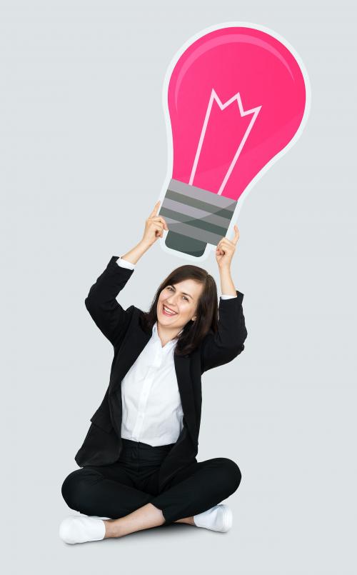Businesswoman holding a light bulb - 492985