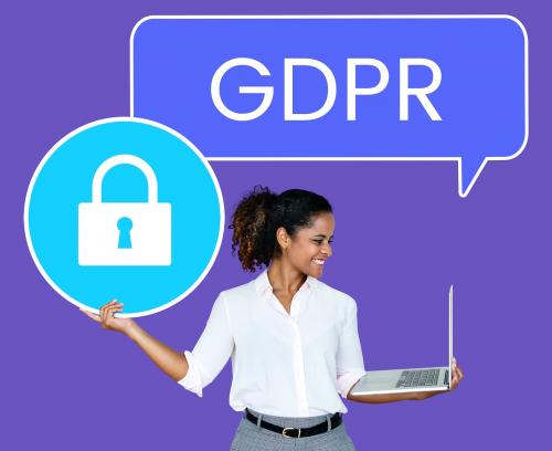 Cheerful woman showing a GDPR security padlock icon - 493207
