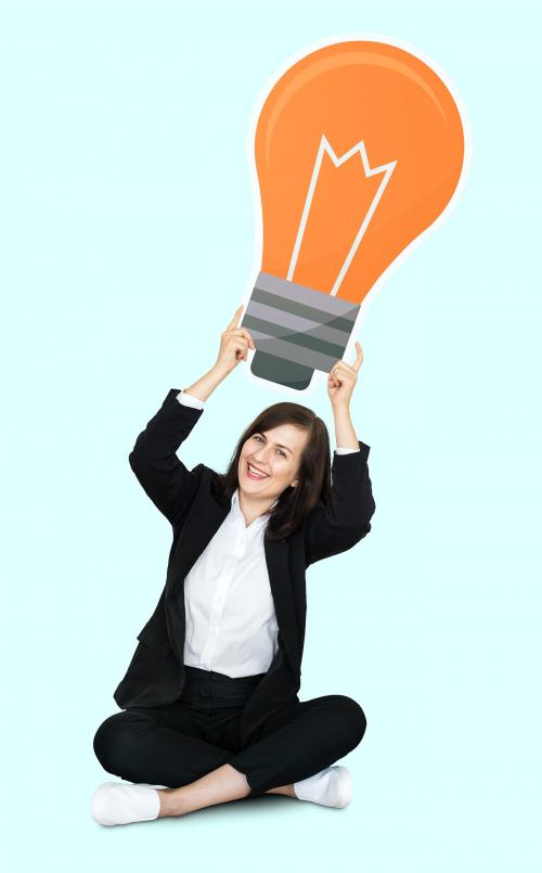 Businesswoman holding a light bulb - 492295