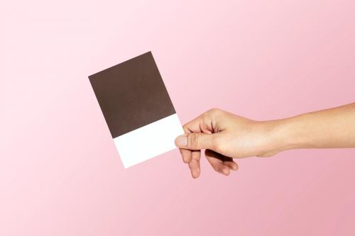 Feminine hand holding a color swatch - 2054338