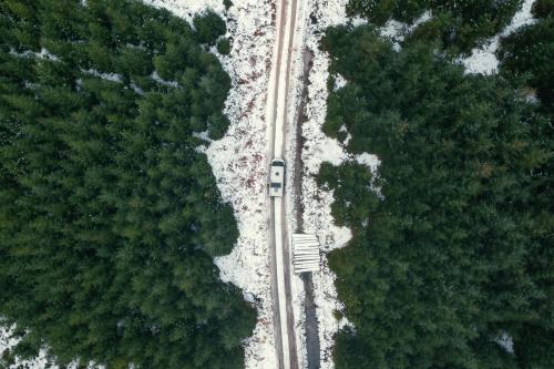 Drone shot of a snowy road in the Trossachs, Scotland - 2097905
