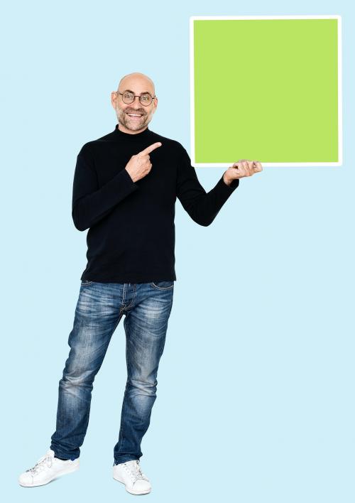 Happy man holding a square shaped board - 492584