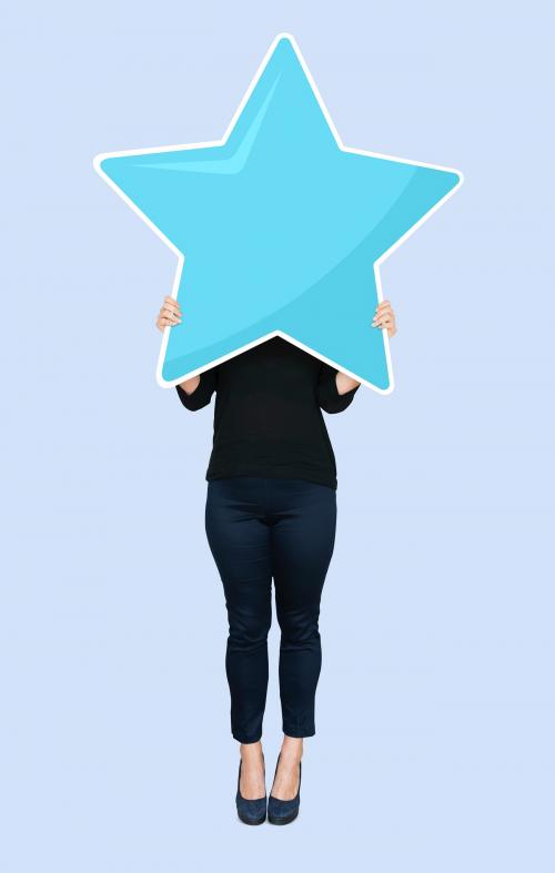 Businesswoman holding a star rating symbol - 492597