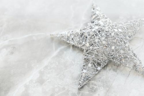 Silver wire Christmas star on marble background - 2035505