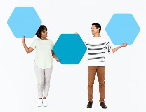 Diverse people showing blue hexagon shaped boards - 490973