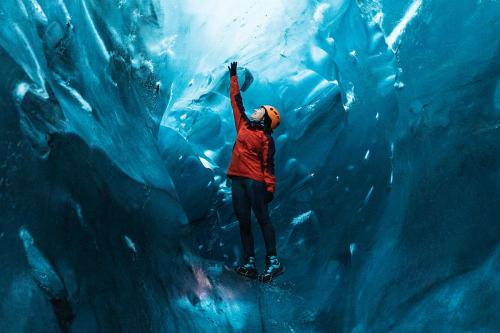 Female explorer in the ice cave, Iceland - 2042875