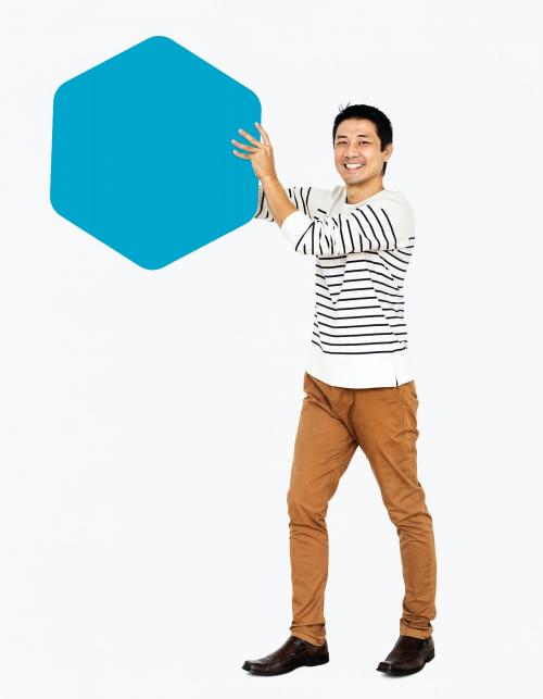 Cheerful man showing a blank blue hexagon board - 491135