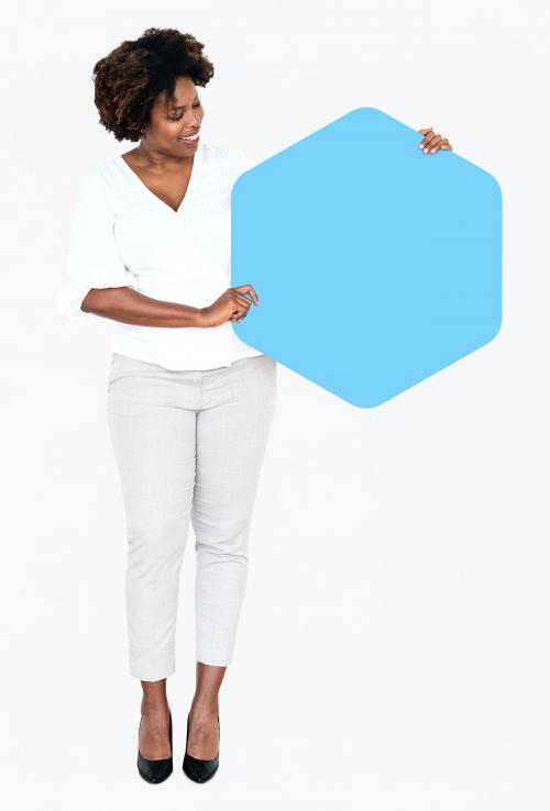 Cheerful woman showing a blank blue hexagon shaped board - 491164
