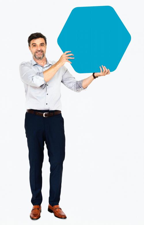 Cheerful man showing a blank blue hexagon shaped board - 491189
